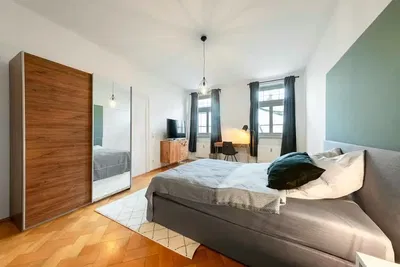 Kitchen; kitchen appliances, wood floor, natural light, modern style