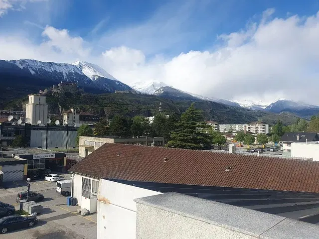 Kitchen; kitchen appliances, wood floor, natural light, modern style