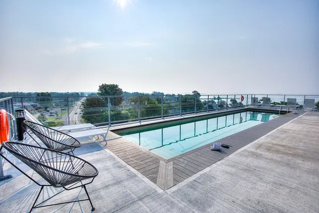 Kitchen; kitchen appliances, wood floor, natural light, modern style