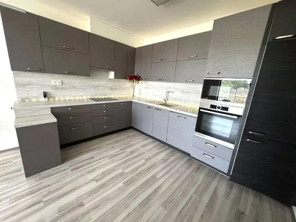 Kitchen; kitchen appliances, wood floor, natural light, modern style
