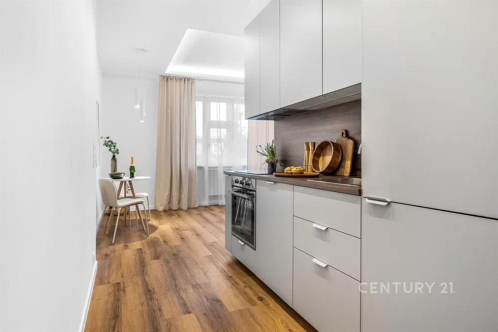 Kitchen; kitchen appliances, tile floor, natural light, modern style