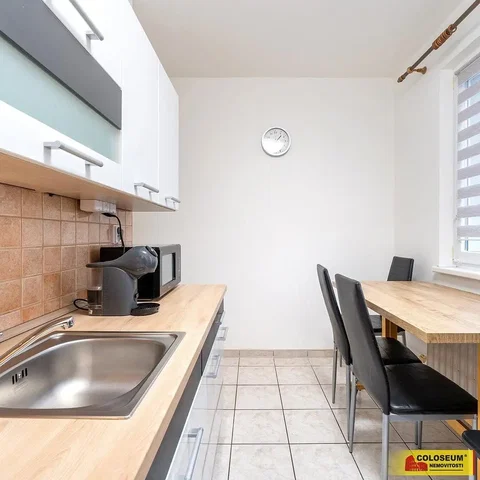 Kitchen; kitchen appliances, wood floor, natural light, modern style