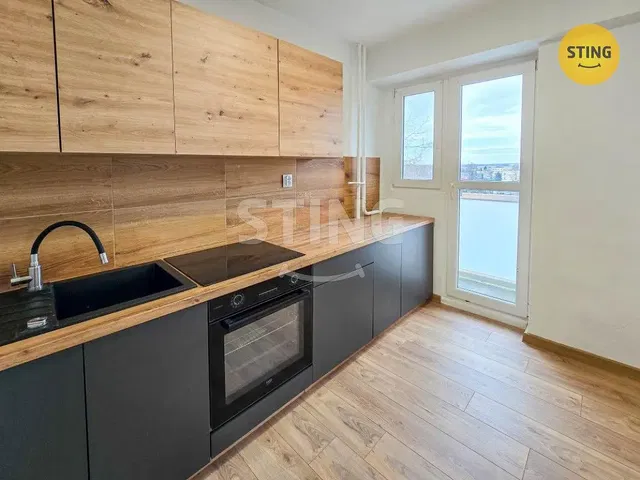 Kitchen; kitchen appliances, wood floor, natural light, modern style