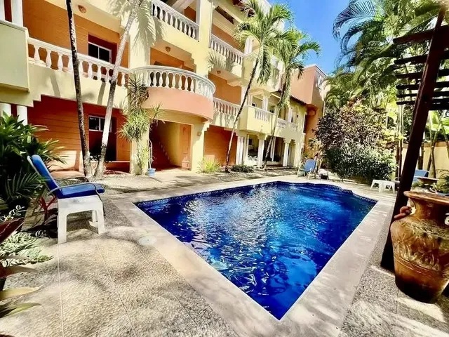 Kitchen; kitchen appliances, wood floor, natural light, modern style