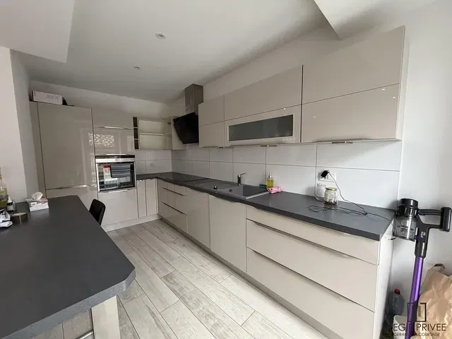 Kitchen; kitchen appliances, wood floor, natural light, modern style