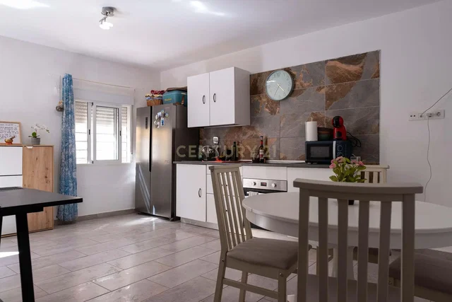 Kitchen; kitchen appliances, wood floor, natural light, modern style