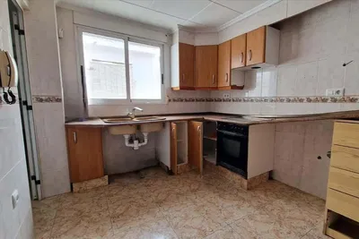 Kitchen; kitchen appliances, wood floor, natural light, modern style