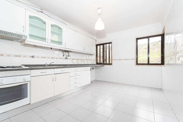 Kitchen; kitchen appliances, wood floor, natural light, modern style