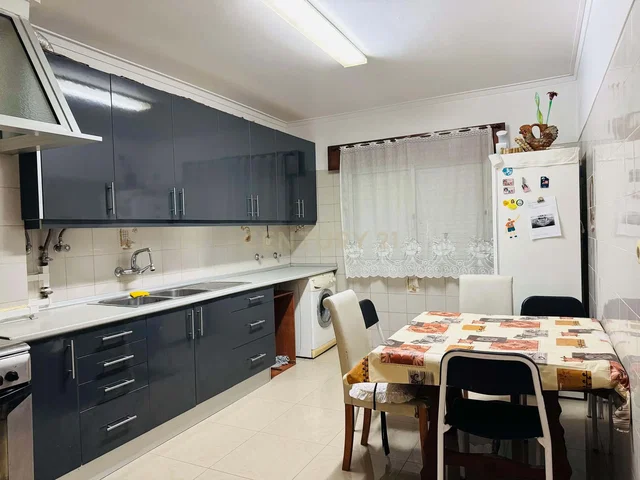 Kitchen; kitchen appliances, wood floor, natural light, modern style