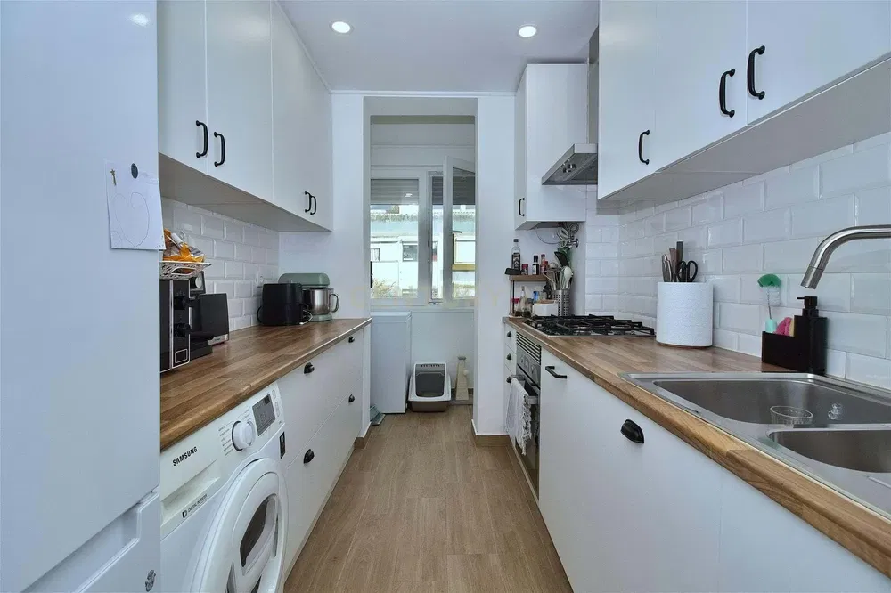 Kitchen; kitchen appliances, wood floor, natural light, modern style