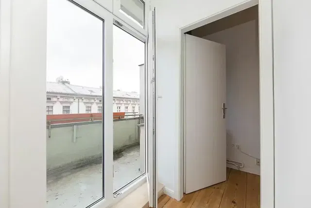Kitchen; kitchen appliances, wood floor, natural light, modern style
