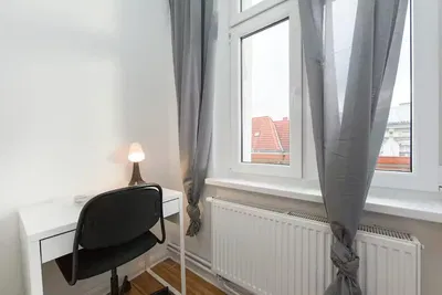 Kitchen; kitchen appliances, wood floor, natural light, modern style