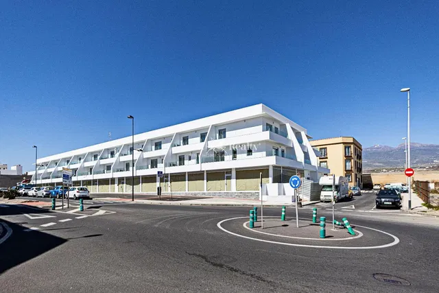 Kitchen; kitchen appliances, wood floor, natural light, modern style