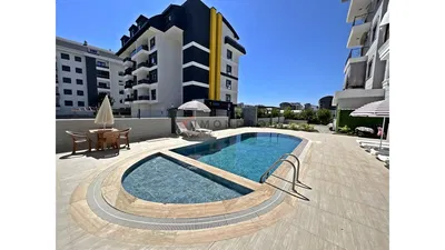 Σαλόνι; ξύλινο πάτωμα, φυσικό φως, μοντέρνο στυλ