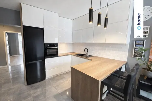 Kitchen; kitchen appliances, wood floor, natural light, modern style