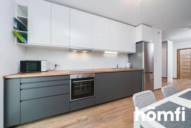 Kitchen; kitchen appliances, wood floor, natural light, modern style