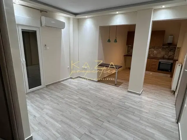 Kitchen; kitchen appliances, wood floor, natural light, modern style