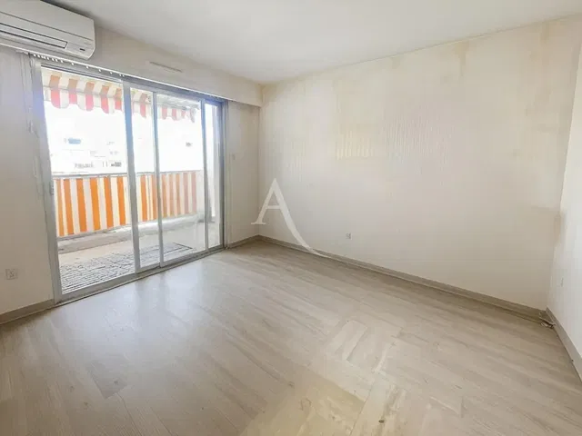 Living room; wood floor, natural light, renovated