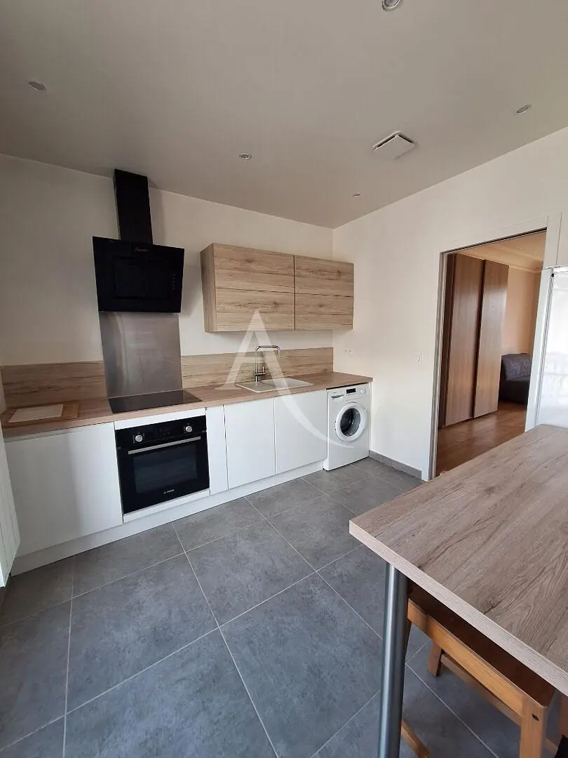 Kitchen; kitchen appliances, tile floor, renovated, natural light, modern style