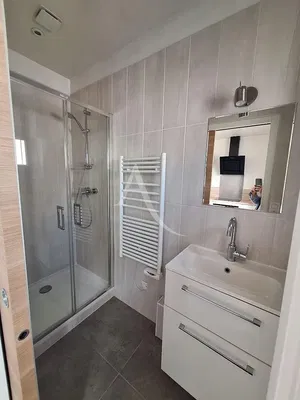 Bathroom; tile floor, renovated, natural light, modern style