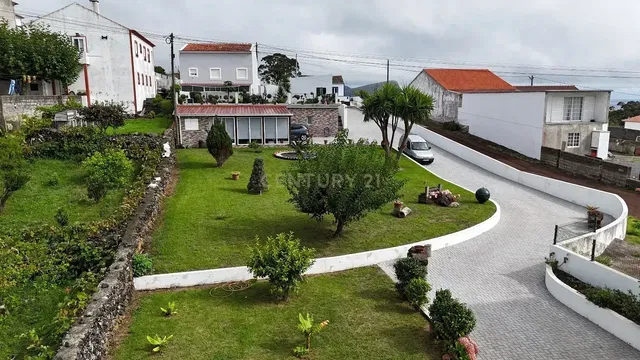 House and surroundings; view