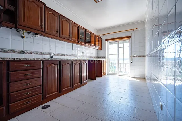 Kitchen; tile floor, natural light, kitchen appliances