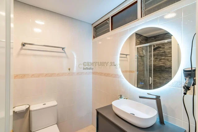 Bathroom; tile floor, renovated, natural light, modern style
