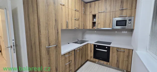 Kitchen; kitchen appliances, wood floor, natural light, modern style