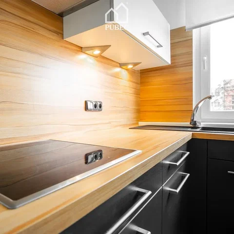 Kitchen; kitchen appliances, wood floor, natural light, modern style