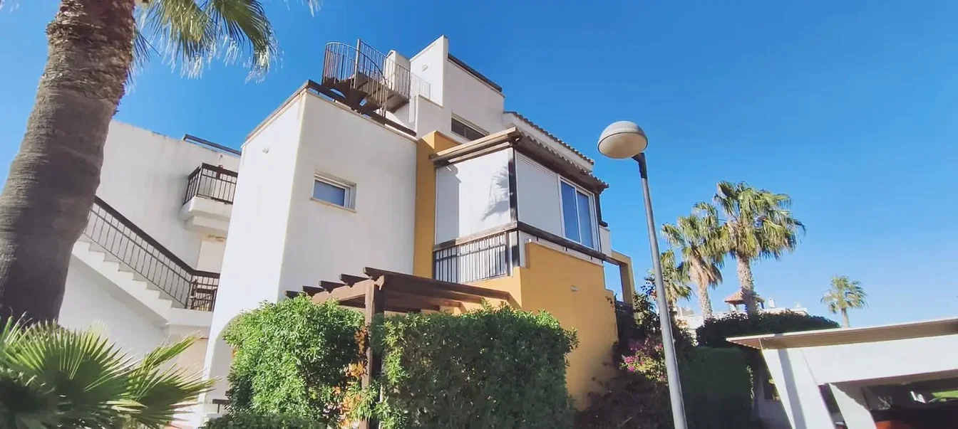 House and surroundings; view