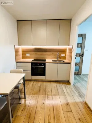 Kitchen; kitchen appliances, wood floor, natural light, modern style