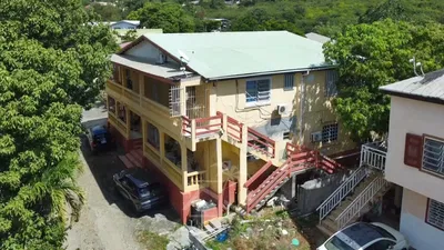 House and surroundings; view