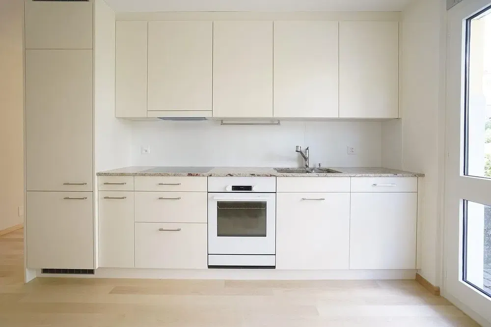 Kitchen; kitchen appliances, natural light, modern style, wood floor