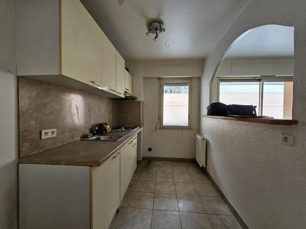 Kitchen; tile floor, needs renovation, natural light