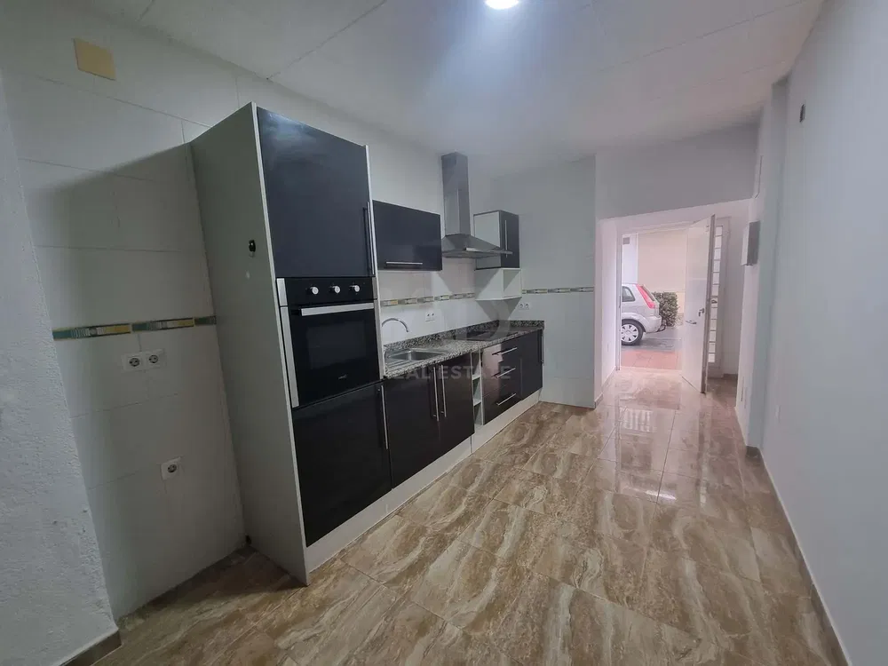 Kitchen; kitchen appliances, tile floor, natural light, renovated