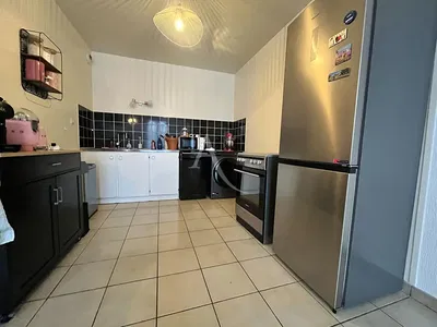 Kitchen; kitchen appliances, tile floor, renovated, natural light, modern style