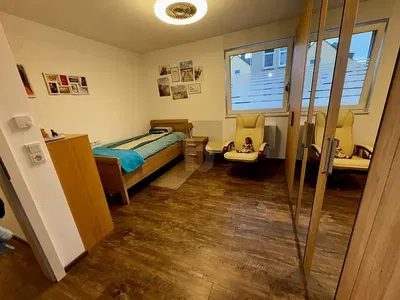 Bedroom; wood floor, natural light, modern style