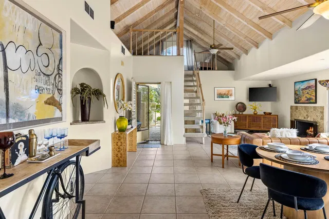 Living room; wood beams, tile floor, fireplace, natural light, modern style