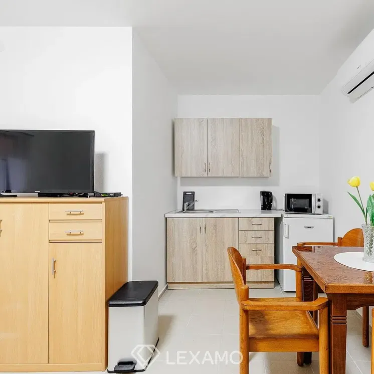 Kitchen; kitchen appliances, tile floor, natural light