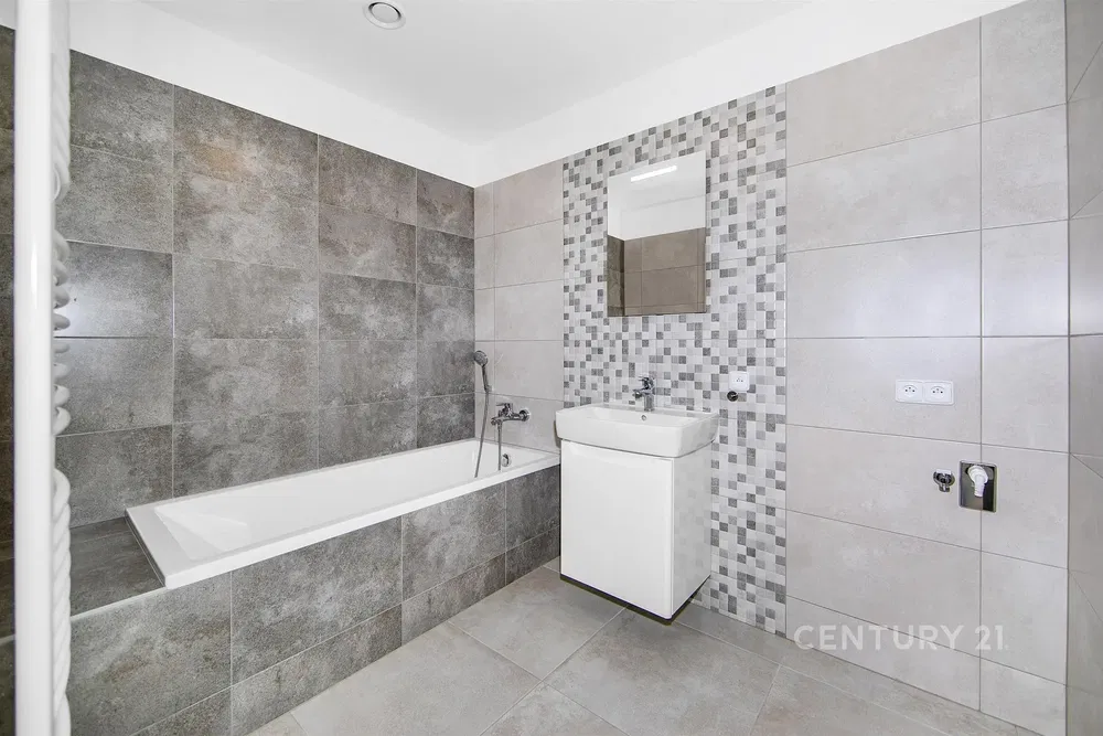Bathroom; tile floor, renovated, natural light, modern style