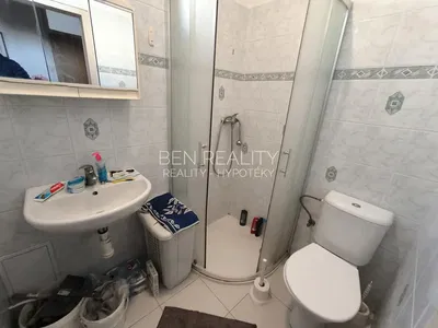 Toilet; tile floor, needs renovation