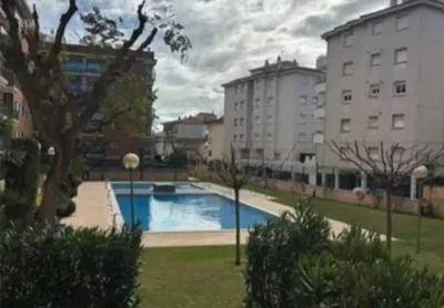 House and surroundings; view