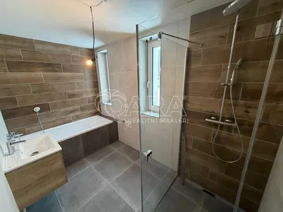 Bathroom; tile floor, renovated, natural light, modern style