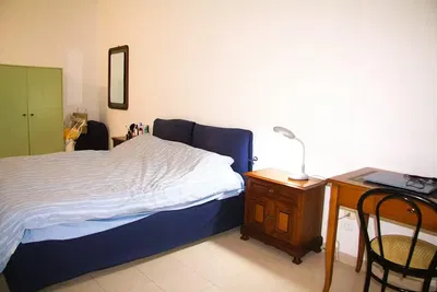 Bedroom; tile floor, natural light