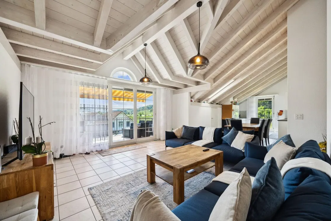 Living room; natural light, wood beams, tile floor