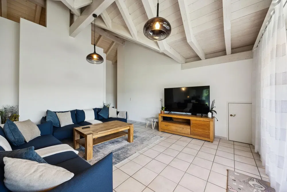 Living room; tile floor, wood beams, natural light