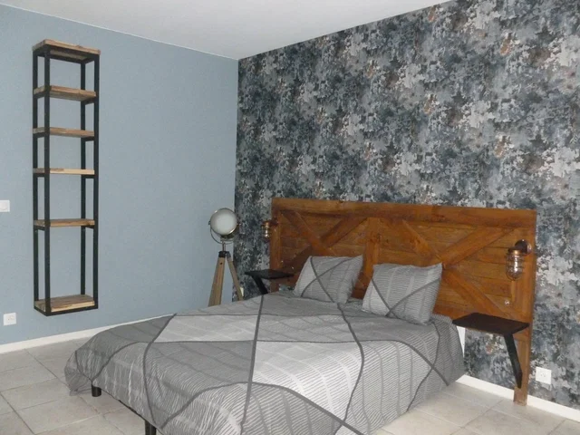 Bedroom; wood beams, tile floor, natural light