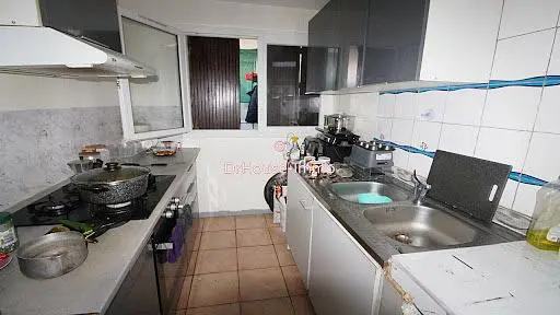 Kitchen; kitchen appliances, tile floor, needs renovation, natural light