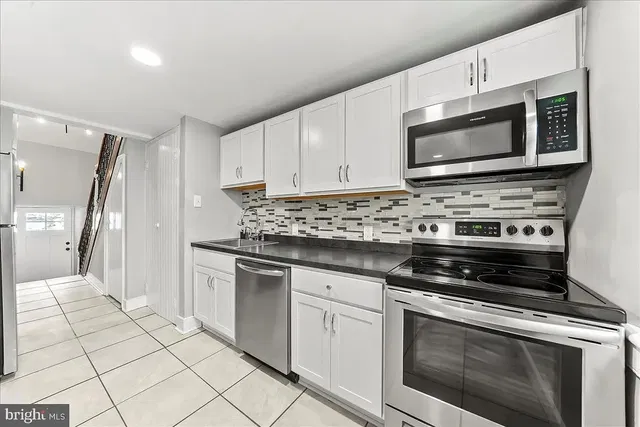 Kitchen; kitchen appliances, tile floor, renovated, natural light, modern style