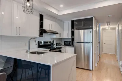 Kitchen; kitchen appliances, tile floor, renovated, natural light, modern style